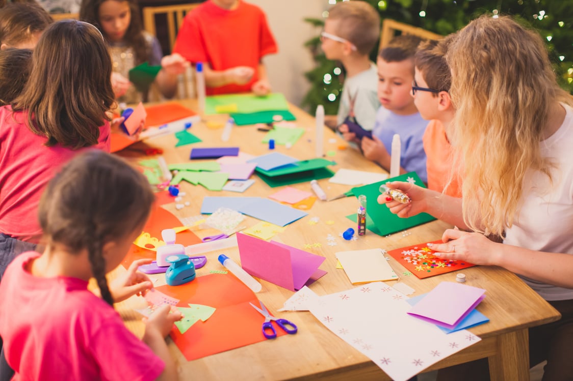 Teacher with Her Children While Christmas Cards Workshop